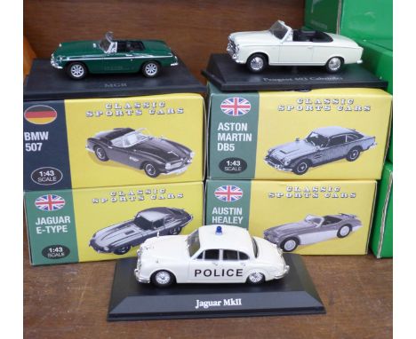 Eight Atlas Editions 1:43 scale die-cast cars including Aston Martin DB5, BMW 507, Jaguar E-Type and MGB roadster, boxed