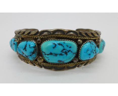 A silver and turquoise bangle, signed Jim Yazzie, 46g