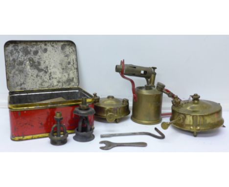 Two Swedish made camping stoves, a Primus blow lamp, fittings and tools
