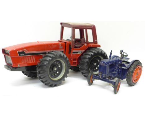 Two model tractors; a blue clockwork Chad Valley Fordson Major and one other red tractor, length of largest 36cm