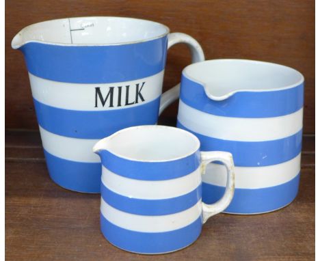 A T.G. Green blue and white measuring jug with scale and two other jugs