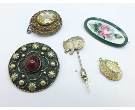 An 800 silver and enamel Egypt charm, three brooches and a pin