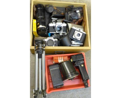 A collection of camera bodies including Nikon FG, two Zenit and Praktica, one lens, tripod, etc.