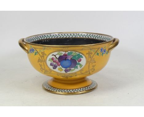 Maling, A yellow ground fruit bowl with fruit reserves and black interior. reglued chip to rim. Height: 12.5cm
