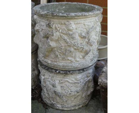 Pair of Large Stone Planter with Putti Designs. Height: 30cm Diameter: 38cm (2)COLLECTION OR COURIER ONLY