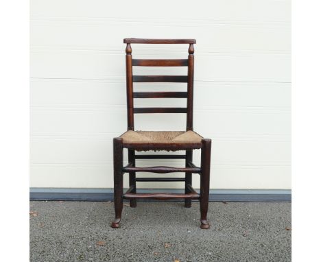 19th century Rush seated Ladder back chair. Straight top rail, whorls to support terminals on three quarter box shaped stretc