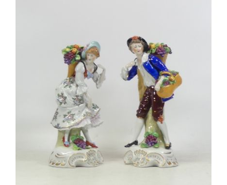 Sitzendorf, Pair of porcelain figures of fruit gatherers. Height of tallest: 24cm (2)