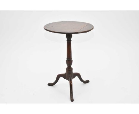 A George III oak tilt-top tripod table, with a three-plank, circular top, top fixed, some restoration, 51.5cm diameter x 71.5