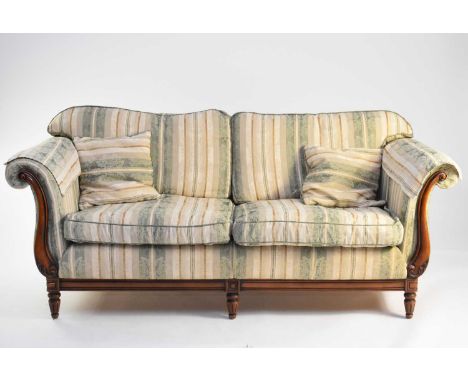 A walnut framed upholstered lounge suite of Chesterfield type, circa 1996, comprising three-seater sofa, two armchairs and a 