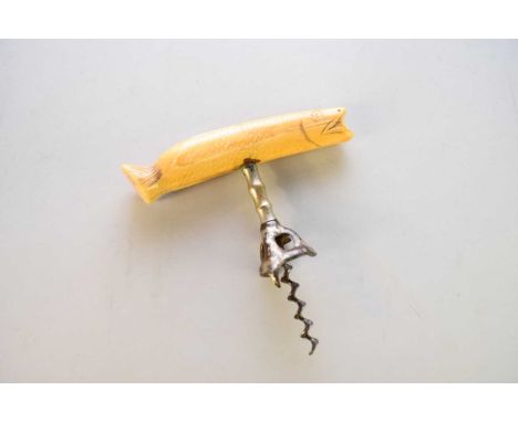 A walrus ivory handle corkscrew in the form of a fish, naively worked, with carved head, scales and tail fin, corkscrew lacki