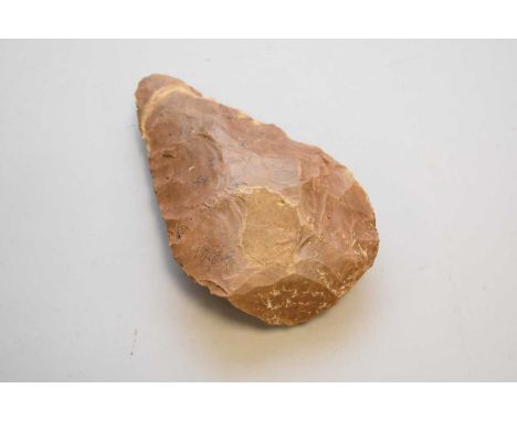 A Neolithic period flint axe head of rough hewn form, 17cm longCondition report: Please refer to images.