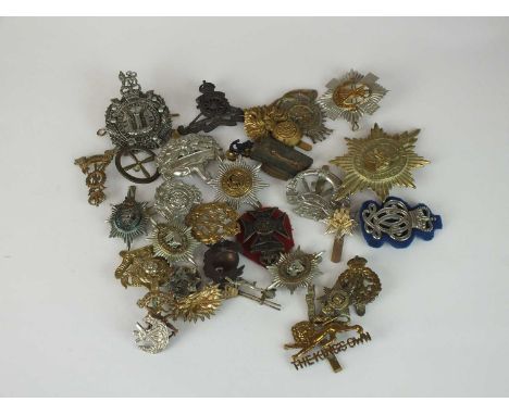 A collection of 30 assorted army badges including The King's Own Scottish Borderers, Engineers, etc