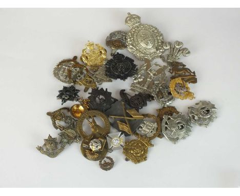 A collection of 30 assorted army and other badges including a Scottish VB helmet plate, Princess of Wales Own, etc