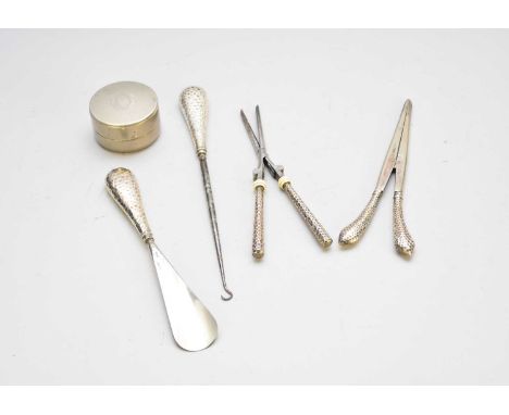 A pair of silver handled glove stretchers, together with a silver handled shoe horn, a silver handled button hook, a pair of 