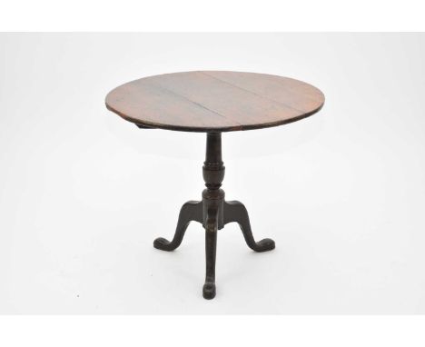 An early 19th century oak tilt-top tripod table, with a three-plank circular top, minor restorations, 82.5cm diameter x 71cm 