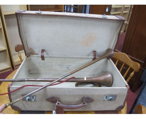 Two Copper Coaching Horns and Bugle, in hessian suitcase bearing military arrow.