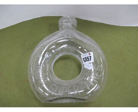 Advertising 'When Tyred Scotch India Super Tyres'. glass decanter of circular tyre form (rim chips), 20cm high.