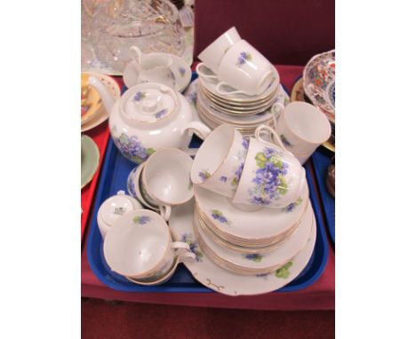 Victoria Early XX Century Tea Service, of approximately forty pieces, in the violets pattern, including teapot.