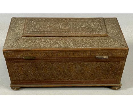 INDIAN SANDALWOOD TRINKET BOX, of sarcophagus form, profusely carved with birds, scrolls, flowers and monkeys, on bun feet, h