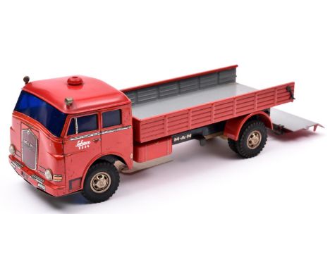 A rare Schuco Elektro-Lastomat 6084 tinplate 2 axle open back M.A.N. Diesel Truck. Cab and rear body in red with litho detail