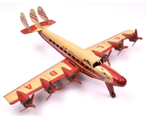 A rare French Joustra tinplate clockwork model of a Lockheed Super Constellation Airliner.  Finished in cream and red Air Fra