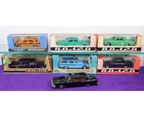 7 Russian made 1:43 Vehicles. 2x Volga - 1 green &amp; 1 black. Volga Taxi in green. Volga airport 'follow me' Estate Car in 