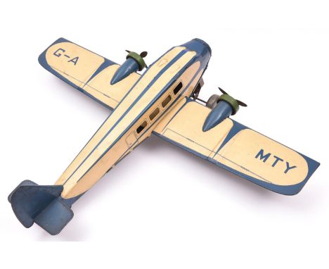 A 1930's Mettoy tinplate clockwork 2 engine Airliner. Finished in cream and blue, with fixed key, 2 propellers, registration 