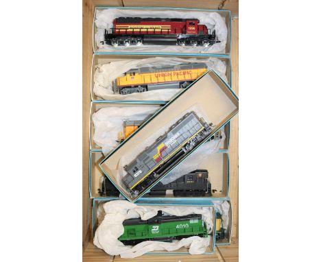 7x HO gauge US railway diesel locomotives by Bachmann, Athearn, Mehano, etc. 2x Union Pacific Bo-Bo locos. A Boston &amp; Mai