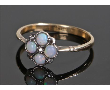 18 carat gold opal set ring, with four opals and five diamonds to the head, ring size M