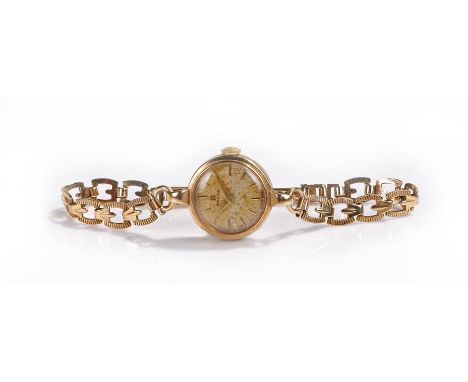 Omega 9 carat ladies wristwatch, the signed silvered dial with baton hours, manual wound, with the 9 carat gold strap, the ca