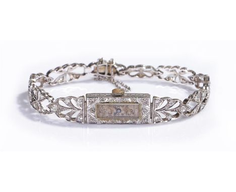 Platinum and diamond ladies wristwatch, the white dial with Arabic hours, diamond set rectangular case and strap, manual woun