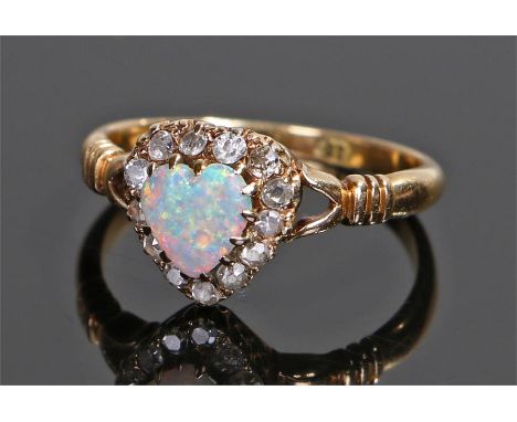 18 carat gold opal and diamond set ring, the opal cut to form a heart with a diamond surround, ring size L 1/2