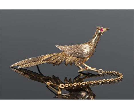 9 carat gold and ruby brooch, in the form of a bird with a ruby eye, 60mm long