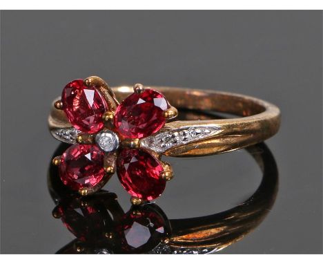 9 carat gold ruby and diamond ring, in the form of a four leaf clover, ring size O