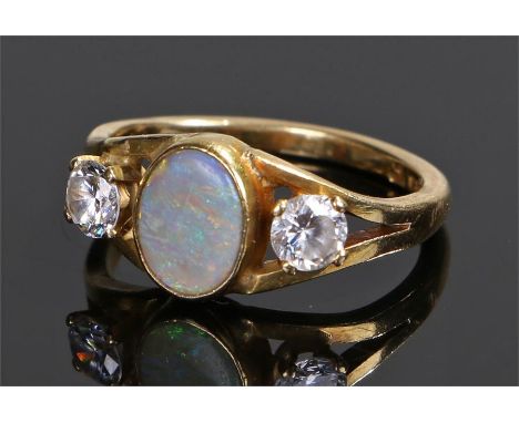 18 carat gold opal set ring, with a central oval opal, ring size L