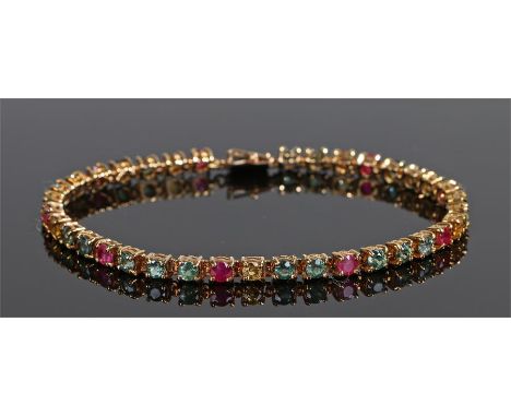 9 carat gold sapphire and ruby bracelet, with green and yellow sapphires interspersed by rubies, 19.5cm long 