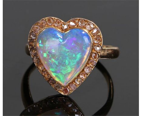 18 carat gold opal and diamond ring, the heart shaped opal with a diamond surround, ring size O