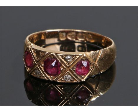 18 carat gold diamond and ruby ring, with three rubies and three diamonds (one missing) ring size N