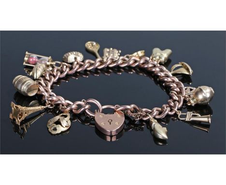 9 carat gold charm bracelet, the chain links with charms attached to include a racket, an urn, a boat, etc, 29.8 grams