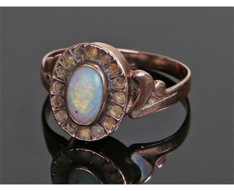 George III opal "poison" ring, the opal set hinged head with arched shoulders, ring size N