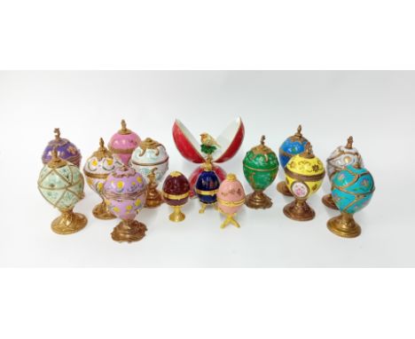 Twelve House of Faberge Musical Eggs, to include eleven Tchaikovsky pieces as flower themed ceramic eggs (some damage to fini