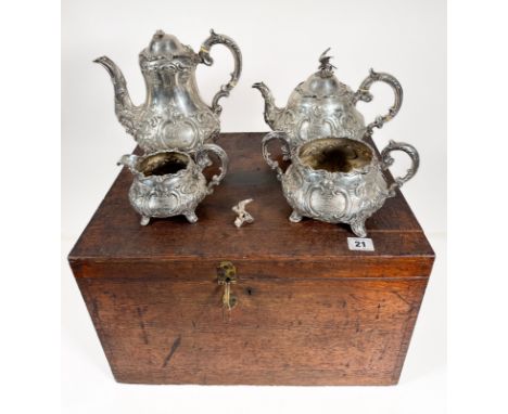 A mid Victorian foliate design silver tea service, comprising of coffee pot (slight damage to finial) and teapot with ivory i