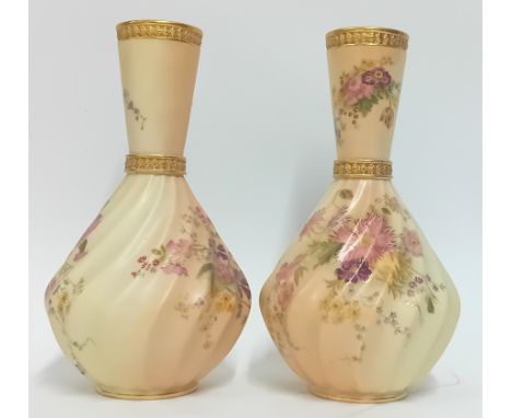 A pair of late 19th century Royal Worcester twist fluted vases, flowers with gold detailing on a blush ground, marked 1452, h