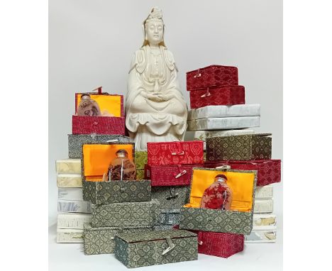 A Chinese reproduction blanc de chine figure in an upholstered box, together with a collection of scent/snuff bottles, boxed.