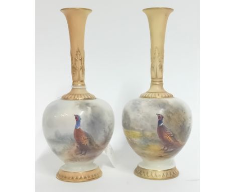 An early 20th century pair of Royal Worcester miniature vases, with gilt detailing and painted pheasant design, signed James 