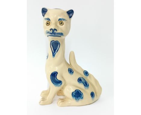 An Aller Vale, Devon ceramic cat with inset glass eyes and elongated neck, blue and white glaze, height 23.5cm.