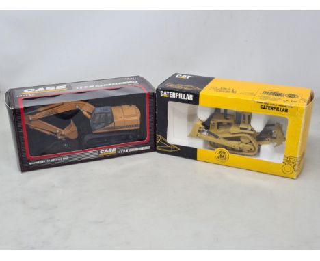 A boxed Joal Caterpillar Train Tractor and a boxed Ertl9030B Excavator