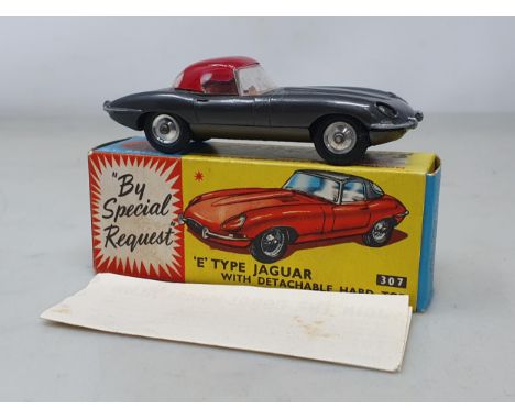 A boxed Corgi Toys No.307 graphite Jaguar E-type, M, box superb