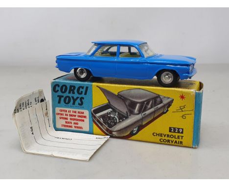 A boxed Corgi Toys No.229 dark blue Chevrolet Corvair, M, box Ex
