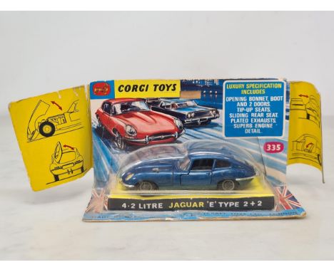A boxed Corgi Toys No.335 dark blue Jaguar 'E' Type 2+2, Nr M, box G